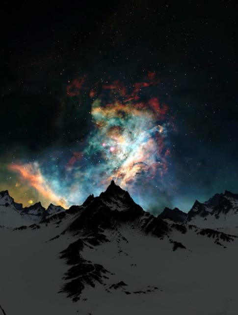 aurora_borealis_over_snow_covered_mountain_tops.jpg